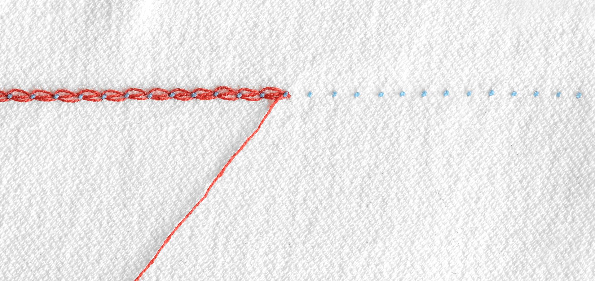 Optimal thread balance (needle heads visible as small dots)