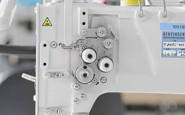 Adjusting needle thread tension